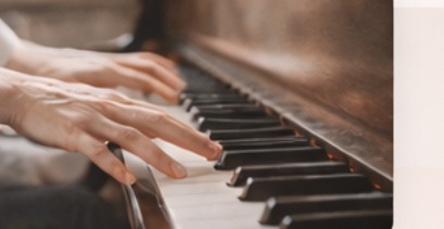 Hands on piano keys